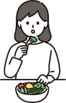 サラダを食べる女性